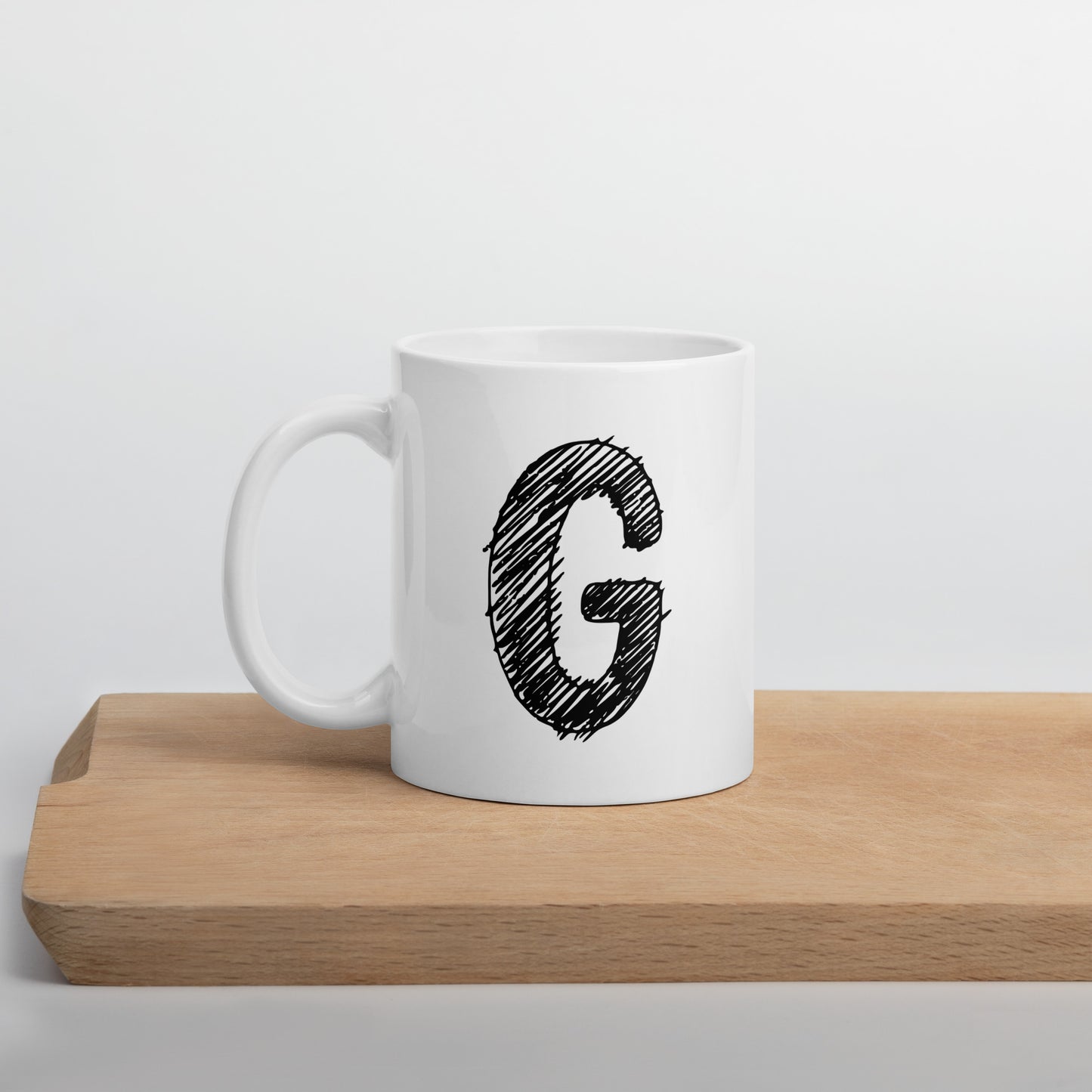 NEOKLASSISCHER BUCHSTABEN "G"Weiße, glänzende Tasse