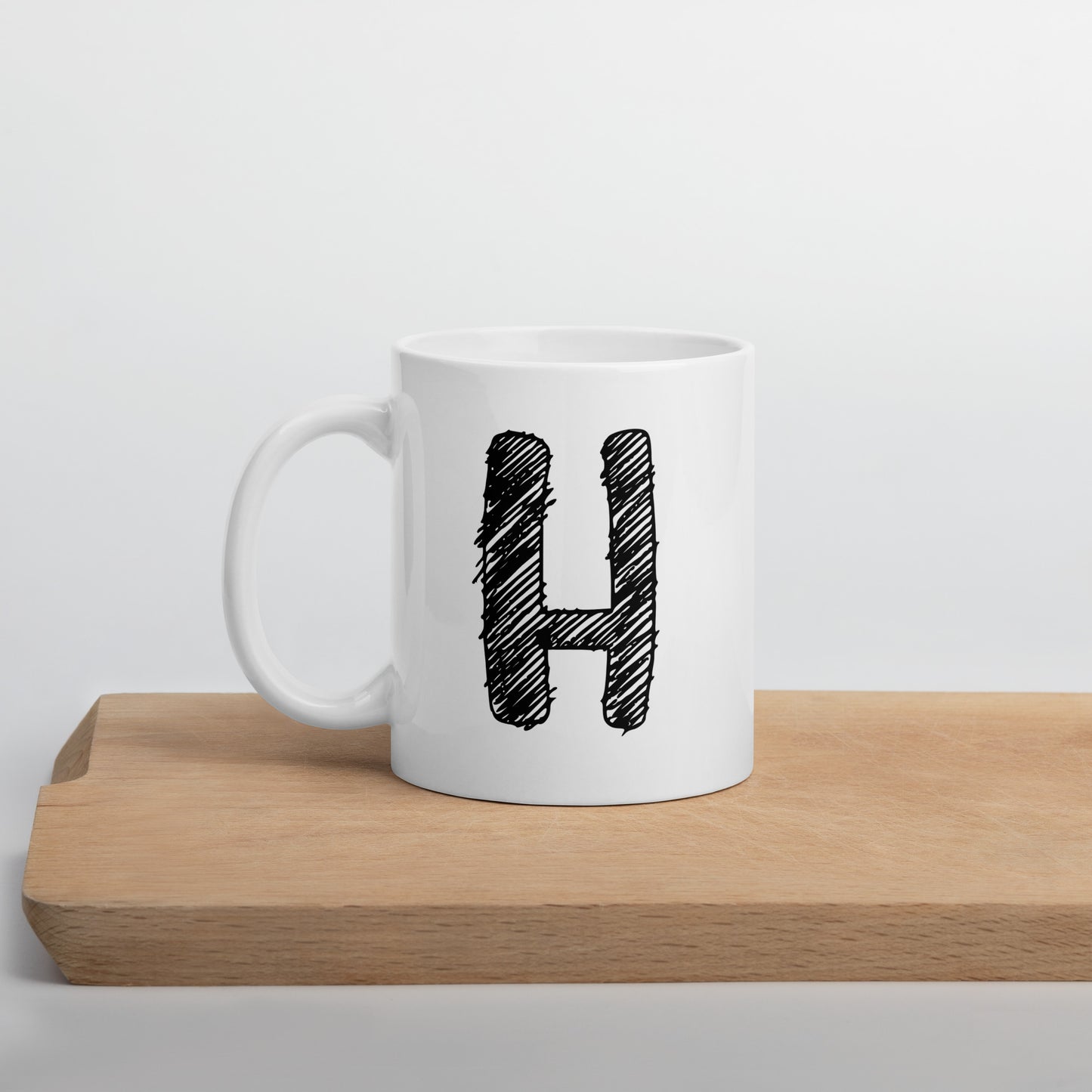 NEOKLASSISCHER BUCHSTABEN "H"Weiße, glänzende Tasse